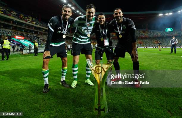 Sporting CP players celebrate winning the Portuguese SuperCup with trophy at the end of the Portuguese SuperCup match between Sporting CP and SC...