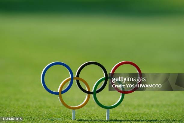 Olympic Rings is used as a tee mark in round 4 of the mens golf individual stroke play during the Tokyo 2020 Olympic Games at the Kasumigaseki...