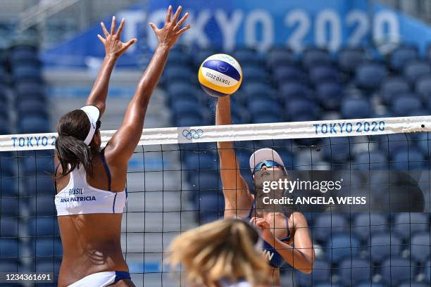 Brazil's Ana Patricia Silva Ramos blocks a shot by China's Wang Fan in their women's beach volleyball round of 16 match between China and Brazil...