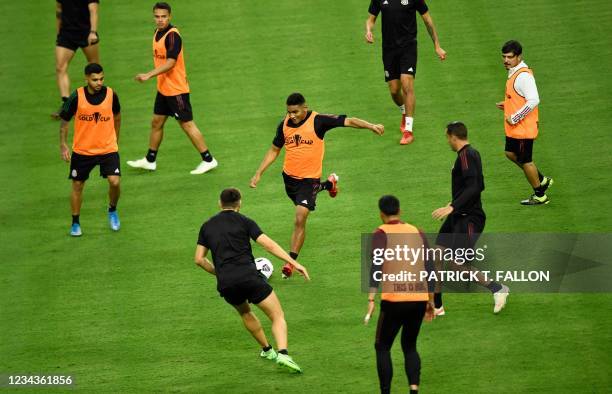 Mexico's defender Gilberto Sepulveda kicks the ball with teammates during a training session ahead of the Concacaf Gold Cup football match final...