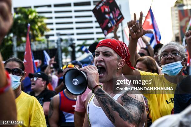 Protestor shouts slogans during a rally in calling for Freedom in Cuba, Venezuela and Nicaragua, in Miami, on July 31, 2021. - Human rights groups...