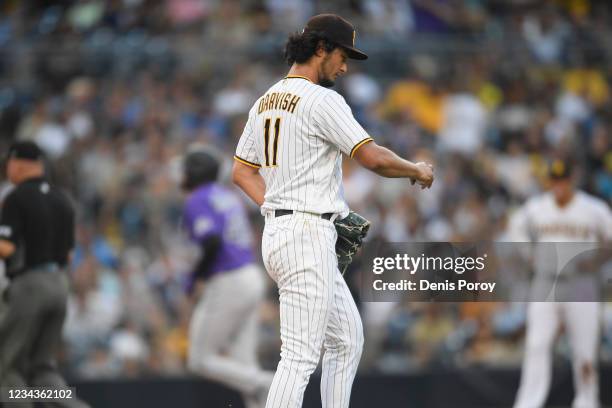 Yu Darvish of the San Diego Padres looks down after giving up a solo home run to German Marquez of the Colorado Rockies during the fifth inning of a...