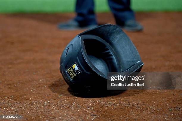 The batting helmet of Jacob Stallings of the Pittsburgh Pirates lays on the field after the celebration of his walk-off RBI fielders choice that gave...