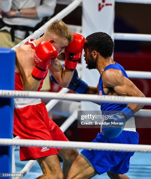 Tokyo , Japan - 1 August 2021; Kurt Walker of Ireland, left, and Duke Ragan of USA during their men's featherweight quarter-final bout at the...