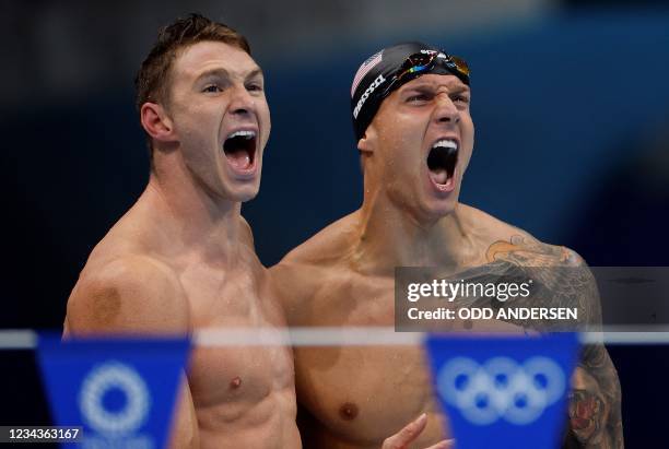 S Ryan Murphy and USA's Caeleb Dressel celebrate winning the final of the men's 4x100m medley relay swimming event during the Tokyo 2020 Olympic...
