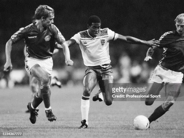 John Barnes of England breaks through the Denmark defence during the UEFA Euro 1984 qualification match at Wembley Stadium on September 21, 1983 in...