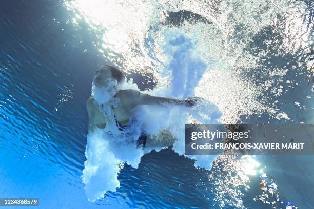 An underwater view shows China's Wang Han after completing a dive in the women's 3m springboard diving final event during the Tokyo 2020 Olympic...