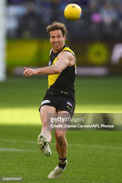 Kane Lambert of the Tigers kicks the ball during the 2021 AFL Round 20 match between the Fremantle Dockers and the Richmond Tigers at Optus Stadium...