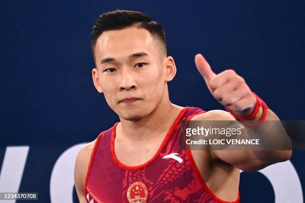 China's Ruoteng Xiao celebrates after competing in the floor event of the artistic gymnastics men's floor exercise final during the Tokyo 2020...