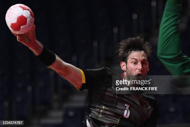Germany's left back Finn Lemke shoots to score during the men's preliminary round group A handball match between Germany and Brazil of the Tokyo 2020...