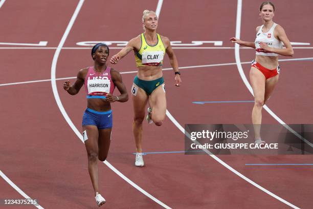 S Kendra Harrison reacts after taking second place ahead of Australia's Elizabeth Clay and Poland's Pia Skrzyszowska in the women's 100m hurdles...