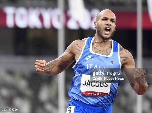 Italy's Lamont Marcell Jacobs reacts after winning the men's 100-meter final of the Tokyo Olympics on Aug. 1 at the National Stadium.
