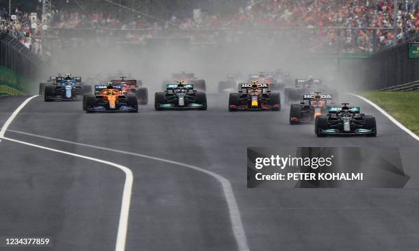 Drivers take the start of the Formula One Hungarian Grand Prix at the Hungaroring race track in Mogyorod near Budapest on August 1, 2021.