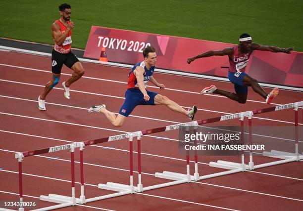 Norway's Karsten Warholm and USA's Rai Benjamin compete in the men's 400m hurdles semi-finals during the Tokyo 2020 Olympic Games at the Olympic...