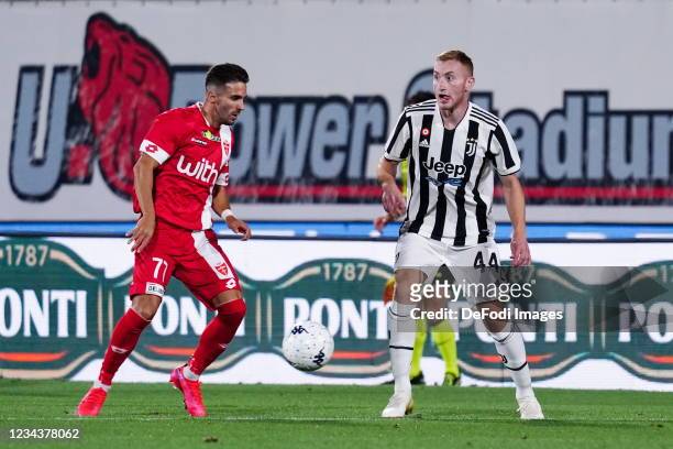 Marco D'Alessandro, Dejan Kulusevski battle for the ball during the Pre-Season Friendly Match between AC Monza and Juventus at Stadio Brianteo on...