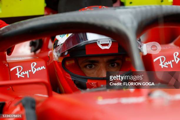 Ferrari's Monegasque driver Charles Leclerc looks on ahead of the Formula One Hungarian Grand Prix at the Hungaroring race track in Mogyorod near...