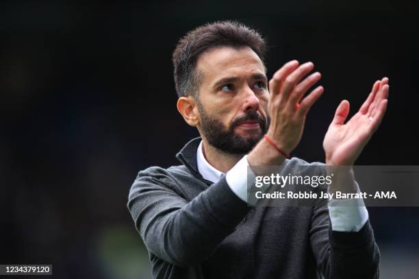 Carlos Corberan the manager / head coach of Huddersfield Town applauds the fans at full time during the Carabao Cup First Round match between...