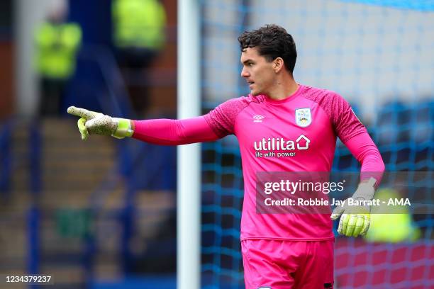 Lee Nicholls of Huddersfield Town celebrates after he saves a penalty during the penalty shootout during the Carabao Cup First Round match between...