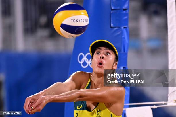 Australia's Taliqua Clancy digs the ball in their women's beach volleyball round of 16 match between Australia and China during the Tokyo 2020...