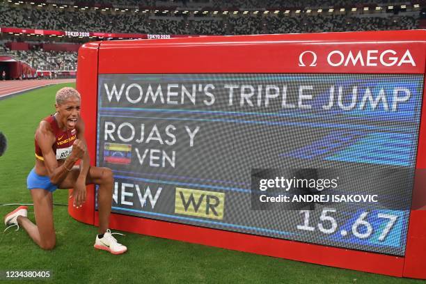 First-placed Venezuela's Yulimar Rojas celebrates the new world record after competing in the women's triple jump final during the Tokyo 2020 Olympic...