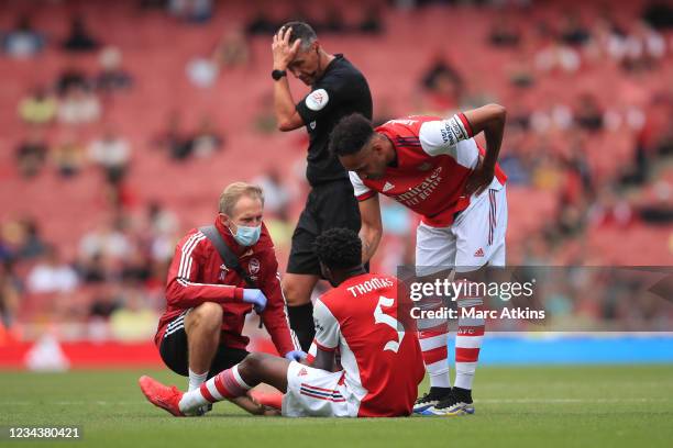 Thomas Partey of Arsenal reacts before leaving the game injured during the Pre Season Friendly between Arsenal and Chelsea at Emirates Stadium on...