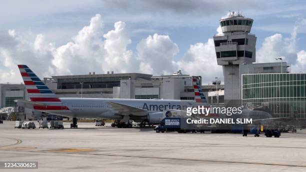 American Airlines planes are seen at the gates at Miami International Airport on August 1, 2021 in Miami, Florida.