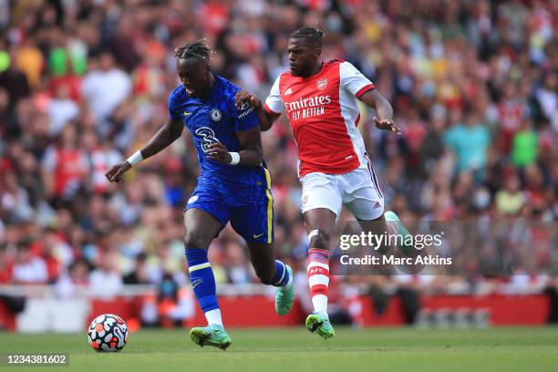 Tammy Abraham of Chelsea in action with Nuno Tavares of Arsenal during the Pre Season Friendly between Arsenal and Chelsea at Emirates Stadium on...