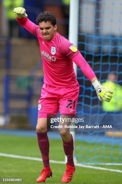 Lee Nicholls of Huddersfield Town celebrates after he saves a penalty during the penalty shootout during the Carabao Cup First Round match between...