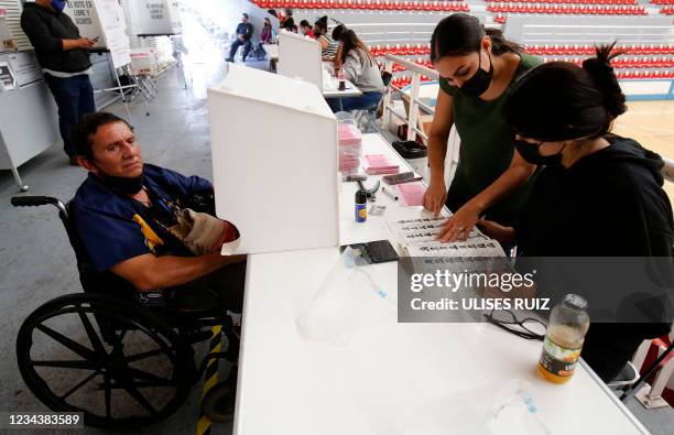 Man waits to vote during a national referendum in Guadalajara, Jalisco state, Mexico, on August 1, 2021. - Mexicans voted Sunday in a national...