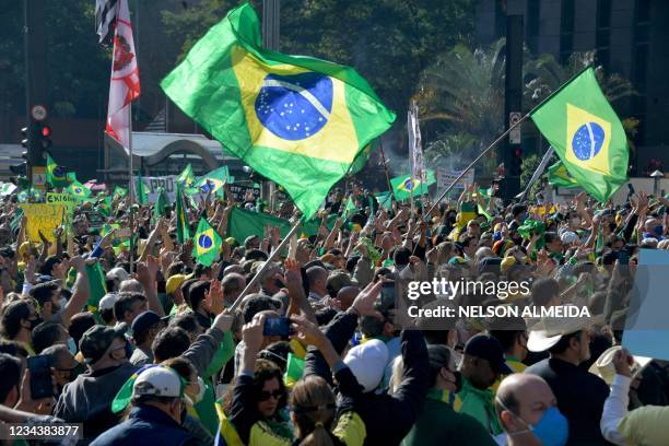 Demonstrators take part in a rally in support of Brazilian President Jair Bolsonaro and calling for a printed vote model at Paulista Avenue in Sao...