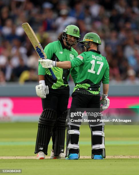 Southern BraveÕs Alex Davies celebrates hitting 50 runs with Colin de Grandhomme during The Hundred match at Lord's, London. Picture date: Sunday...