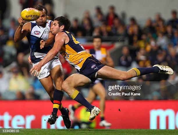 Graham Johncock of the Crows gets tackled by Jack Darling of the Eagles during the round 24 AFL match between the West Coast Eagles and the Adelaide...