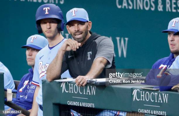 Manager Chris Woodward of the Texas Rangers reacts in the dugout as the Rangers play the Seattle Mariners during the sixth inning at Globe Life Field...