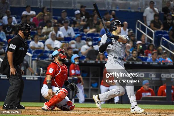 Joey Gallo of the New York Yankees doubles in the seventh inning against the Miami Marlins at loanDepot park on August 1, 2021 in Miami, Florida.