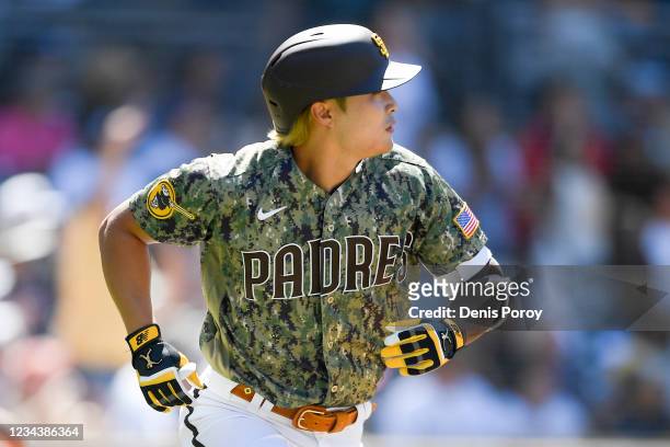 Ha-Seong Kim of the San Diego Padres watches the flight of his solo News  Photo - Getty Images