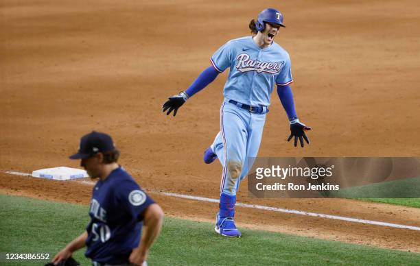 Jonah Heim of the Texas Rangers reacts after hitting a walk off solo home run to defeat the Seattle Mariners 4-3 at Globe Life Field on August 1,...