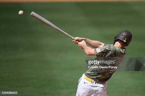 Wil Myers of the San Diego Padres hit an RBI single during the fifth inning of a baseball game against Colorado Rockies at Petco Park on August 1,...