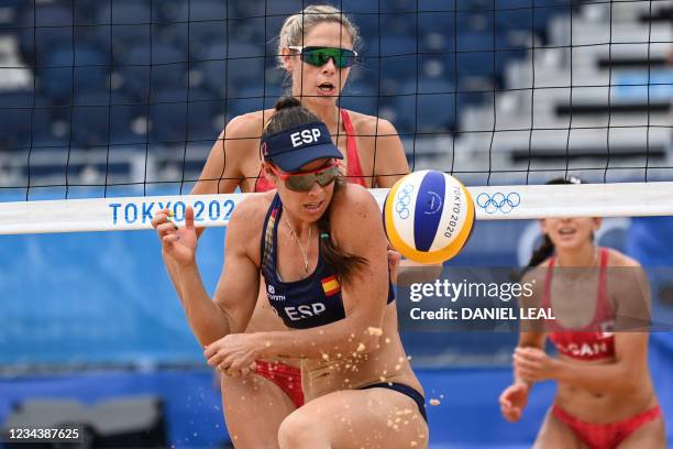 Spain's Elsa Baquerizo McMillan reacts as Canada's Sarah Pavan watches in their women's beach volleyball round of 16 match between Canada and Spain...