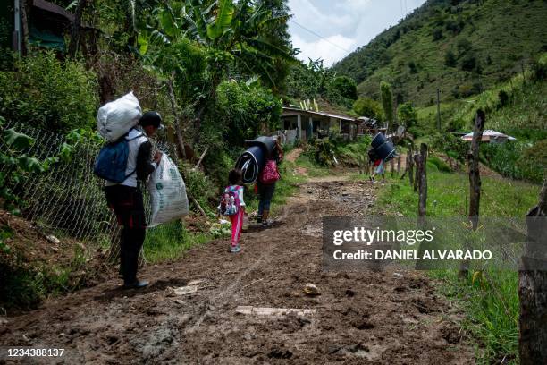 Displaced people return to their homes in the rural areas of Ituango, Colombia, on August 1, 2021. - More than 4,000 people abandoned their homes in...
