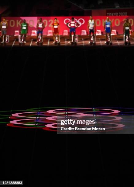 Tokyo , Japan - 1 August 2021; The Olympic Rings are projected onto the track before the men's 100 metres final at the Olympic Stadium on day nine of...