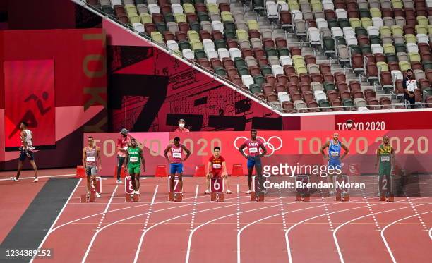 Tokyo , Japan - 1 August 2021; Zharnel Hughes of Great Britain, left, leaves the track after being disqualified for a false start as Andre de Grasse...