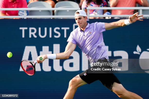 John Isner of the United States looks to return a shot from Brandon Nakashima of the United States during the singles final match at the Truist...