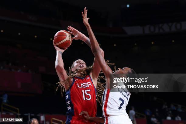 S Brittney Griner goes to the basket past France's Sandrine Gruda in the women's preliminary round group B basketball match between France and USA...