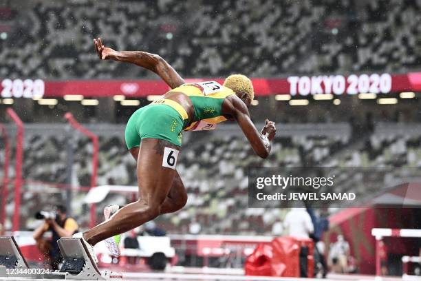 Jamaica's Janieve Russell starts in the women's 400m hurdles semi-finals during the Tokyo 2020 Olympic Games at the Olympic stadium in Tokyo on...