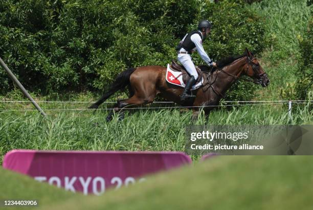 August 2021, Japan, Tokio: Equestrian/Eventing: Olympic, Preliminary, Cross Country, on the Sea Forest XC Course. Robin Godel from Switzerland on Jet...