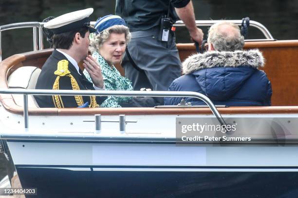 Imelda Staunton and other cast members are seen on a boat made to look like a Royal yacht tender in the harbour during filming for the Netflix series...