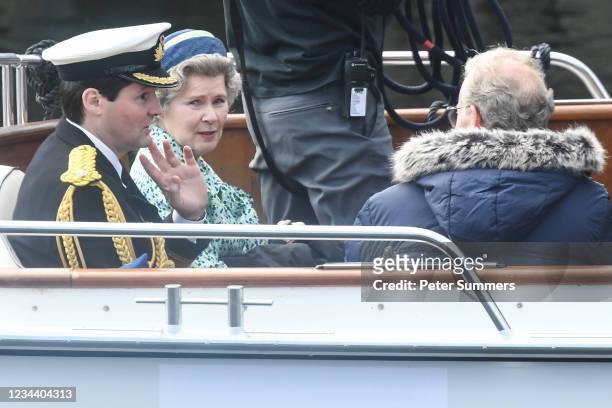 Imelda Staunton and other cast members are seen on a boat made to look like a Royal yacht tender in the harbour during filming for the Netflix series...
