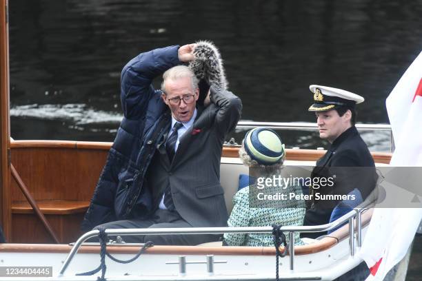 Andrew Havill and other cast members are seen on a boat made to look like a Royal yacht tender in the harbour during filming for the Netflix series...