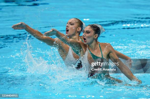 Greece's Evangelia Papazoglou and Greece's Evangelia Platanioti compete in the preliminary for the women's duet free artistic swimming event during...