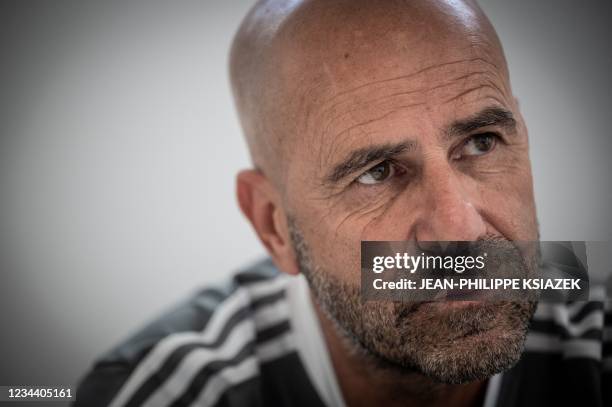 Olympique Lyonnais Dutch head coach Peter Bosz looks on during an interview at the Groupama Stadium, in Decines-Charpieu, near Lyon, south-central...